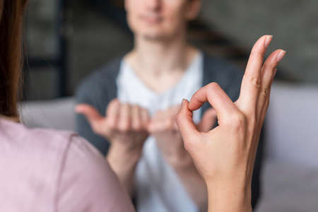 couple talking using sign language