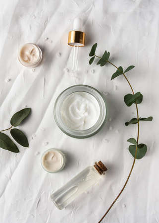 top view cream container with plant. High quality photo