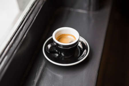 leftover coffee black cup window sillの写真素材