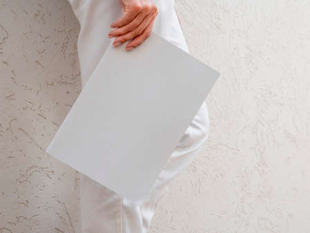 woman holding mock up magazine. High quality photo
