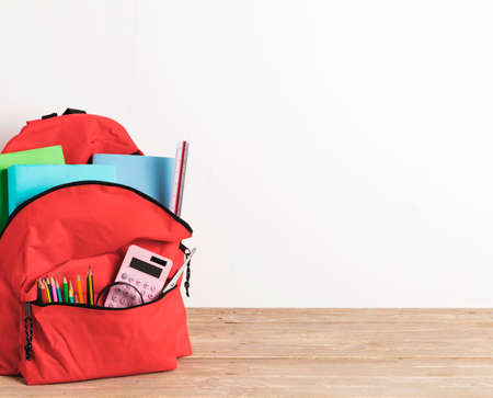red school bag with essential supplies. High quality photoの写真素材