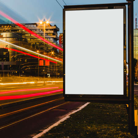 empty white billboard with light trails city nightの写真素材