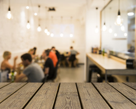 wooden table looking out people mensaの写真素材