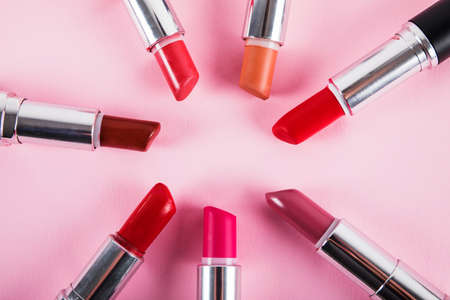 collection various colorful lipsticks pink surfaceの写真素材