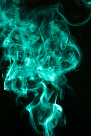 fluffy puffs green smoke fog black background. High quality photoの写真素材