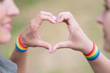 lesbian couple with lgbt bracelete. High quality photoの写真素材