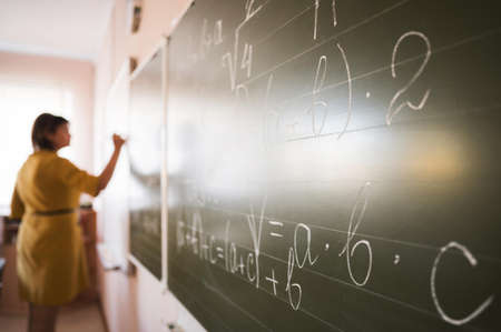 portrait teacher writing chalkboard. High quality beautiful photo conceptの写真素材