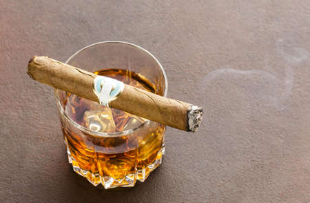 high angle whiskey glass with ice cigar 2. High quality beautiful photo conceptの写真素材