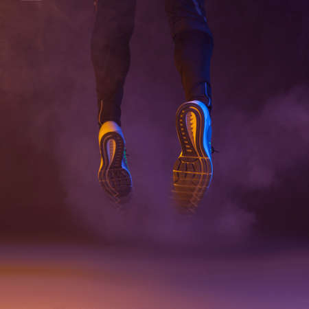 jumping legs smoke. High quality photoの写真素材