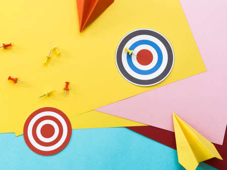 flat lay paper targets with pins paper planes. High quality photoの写真素材