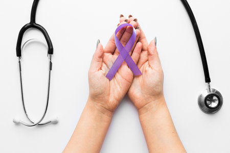 crop hands with violet ribbon near stethoscope. High quality photoの写真素材