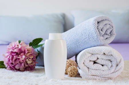 arrangement with towels bottle flower bed. High quality photoの写真素材