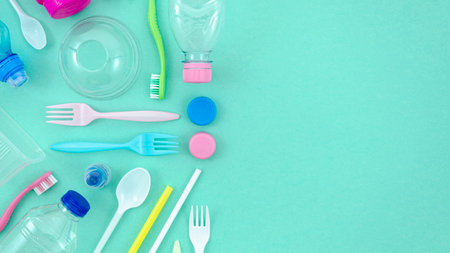 colorful plastic tableware turquoise background. High quality photoの写真素材