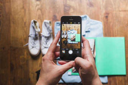 human hand taking photo personal accessories table. High quality beautiful photo conceptの写真素材