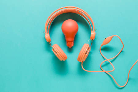 earphones lamp colored surface. High quality photoの写真素材