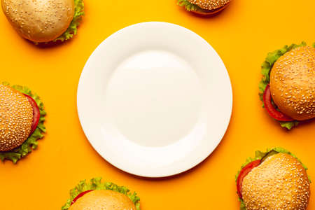 flat lay burgers with empty plate. High quality photoの写真素材