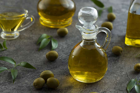 High view of bottles filled with olive oil on marble background Picture on pik. High quality...
