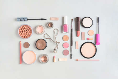 makeup products arranged rectangular shape white backdrop. High quality photoの写真素材