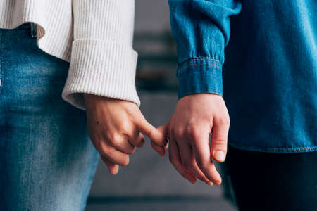 females hooking each other little finger. High quality photo