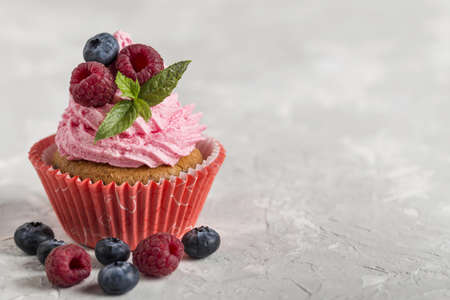 front view view tasty cupcake with strawberry cream. High quality beautiful photo conceptの写真素材