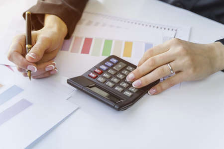 hands counting calculator with pen. High quality beautiful photo concept