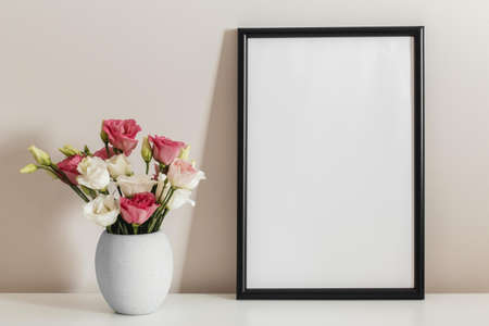 front view bouquet roses vase with empty frame.の写真素材