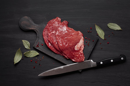 fresh uncooked meat wooden board with knife. High quality beautiful photo concept