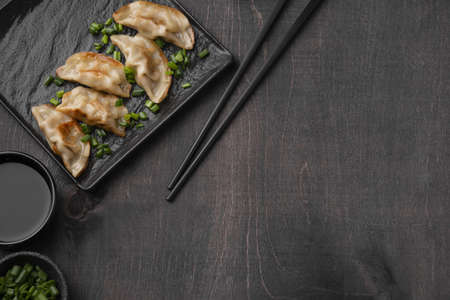 flat lay asian dumplings dish slate with copy space. High quality beautiful photo concept