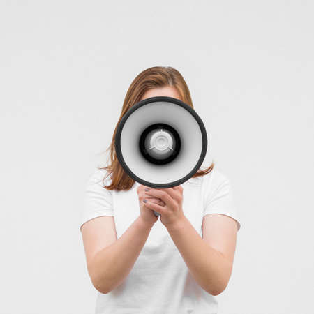 front view girl screaming megaphone. High quality photoの写真素材