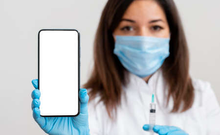 doctor holding mobile phone. High quality photoの写真素材