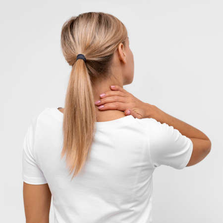back view woman with neck pain. High quality photoの写真素材