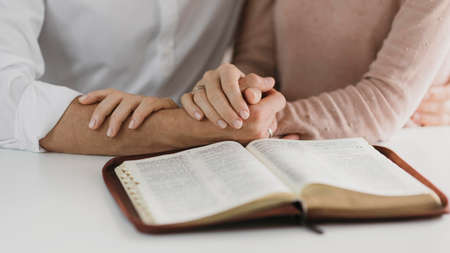 husband wife reading bible together. High quality photoの写真素材