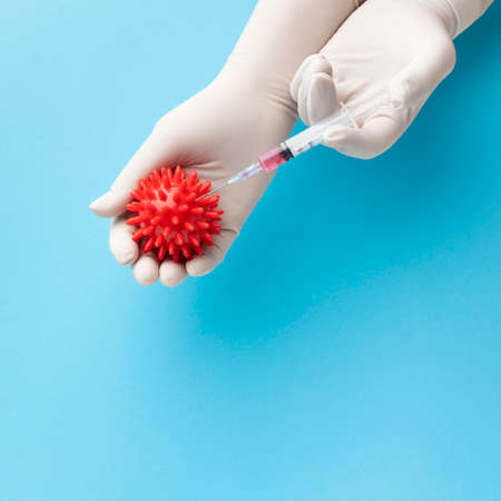 top view hand holding virus syringe with vaccine. High quality photoの写真素材