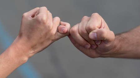 pinky promise from man woman. High quality photoの写真素材