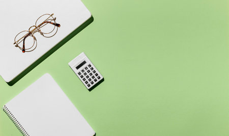 top view desk minimal glasses calculator. High quality photoの写真素材