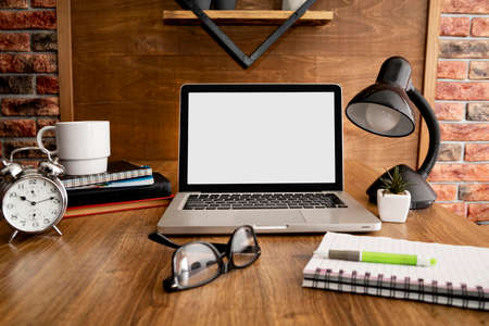 front view laptop lamp wooden office workspace. High quality photoの写真素材