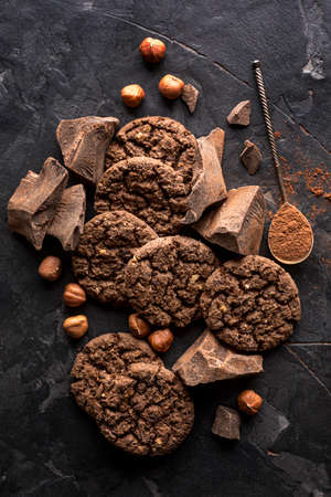 top view chocolate cookies with hazelnuts cocoa powder. High quality photo