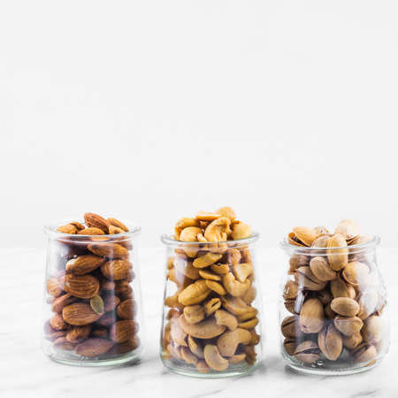almonds cashewnuts pistachios marble backdrop. High quality photoの写真素材