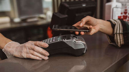 close up customer paying her coffee bill. High quality photo