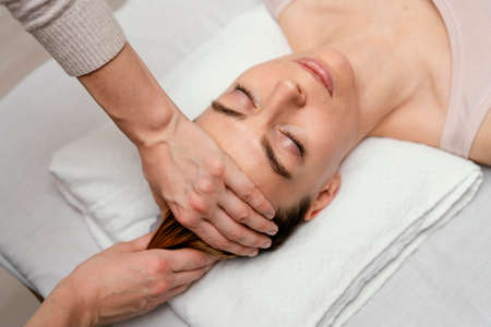 close up therapist massaging patient s hair. High quality photoの写真素材