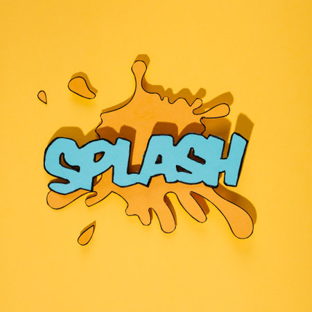blue splash text blot against yellow background. High quality photoの写真素材