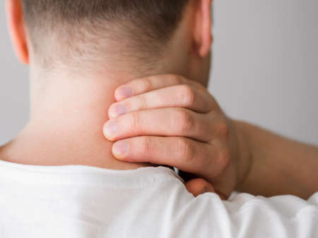 man with neck pain. High quality photoの写真素材