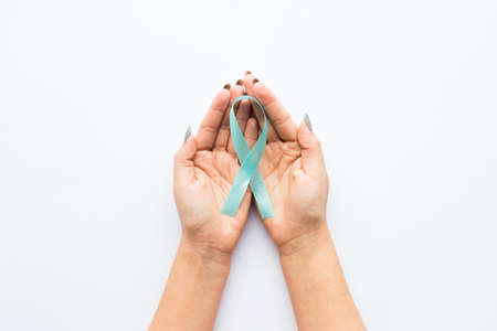 light blue ribbon crop hands. High quality photoの写真素材