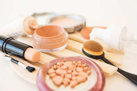 close up woman s cosmetics used makeup powder brush lipstick cream. High quality photoの写真素材