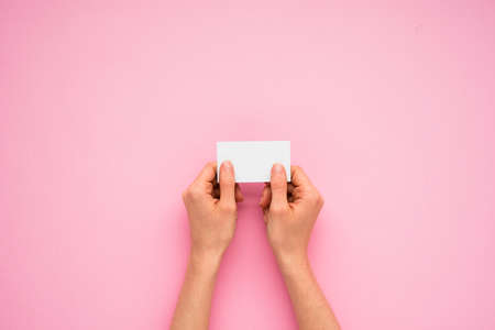 person hands holding little paper. High quality photoの写真素材
