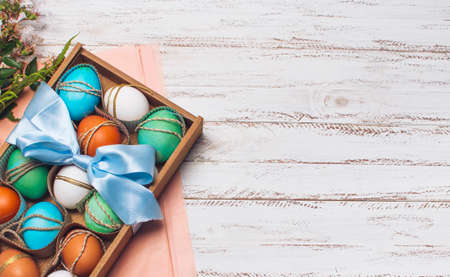 collection bright eggs box pink craft paper near plants. High quality photo