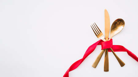 spoon knife fork with red ribbon. High quality photoの写真素材