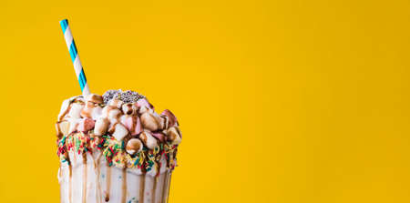 close up view delicious milkshake with yellow background. High quality photoの写真素材
