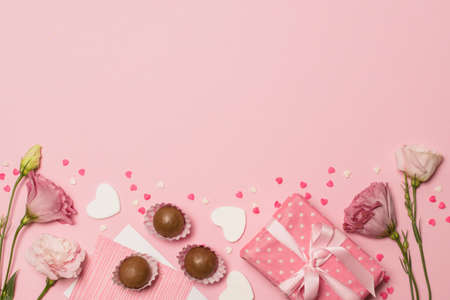 flowers near post card present box chocolate candies. High quality photoの写真素材