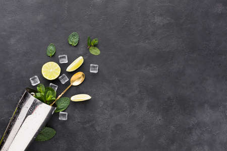 top view cocktail essentials with mint shaker . High quality photo